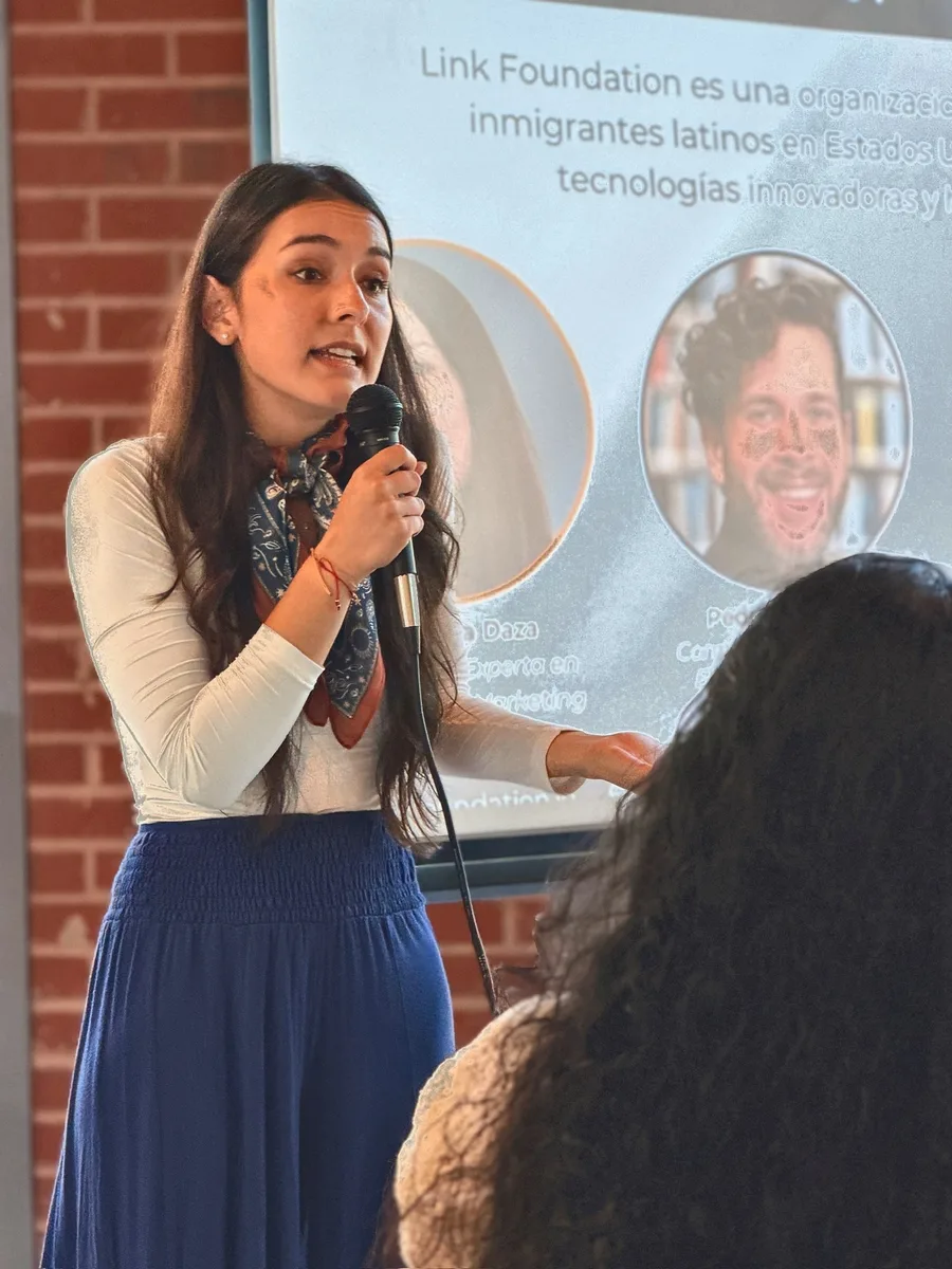 A speaker sharing ideas with the Cafecito Tech community