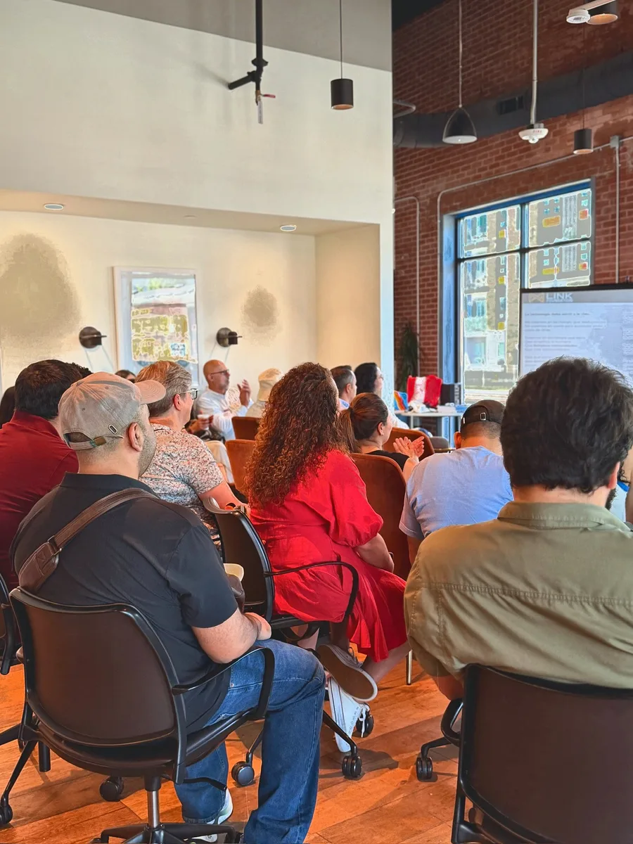 Community members listening at Cafecito Tech